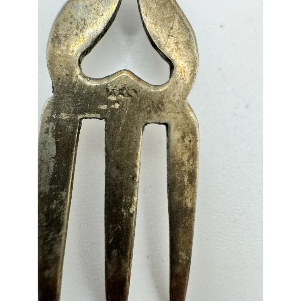 Ornate Italian souvenir fork with a lion rampant and crown motif